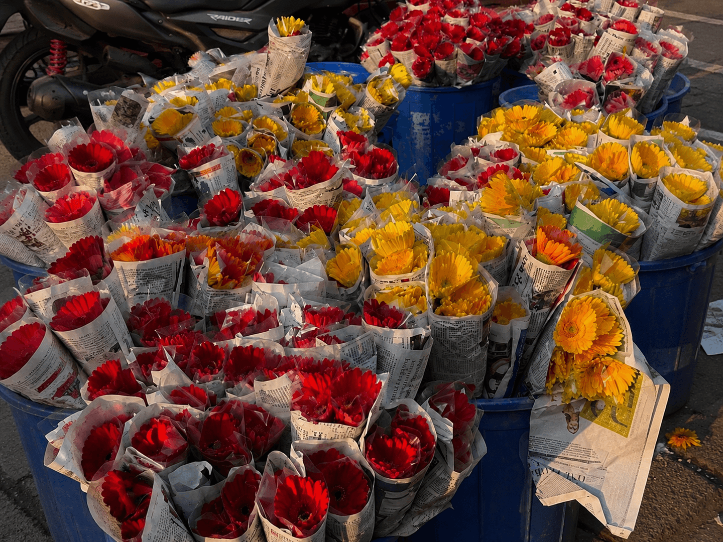 Fresh flowers at the wholesale market — gerberas and roses wrapped in newsprint
