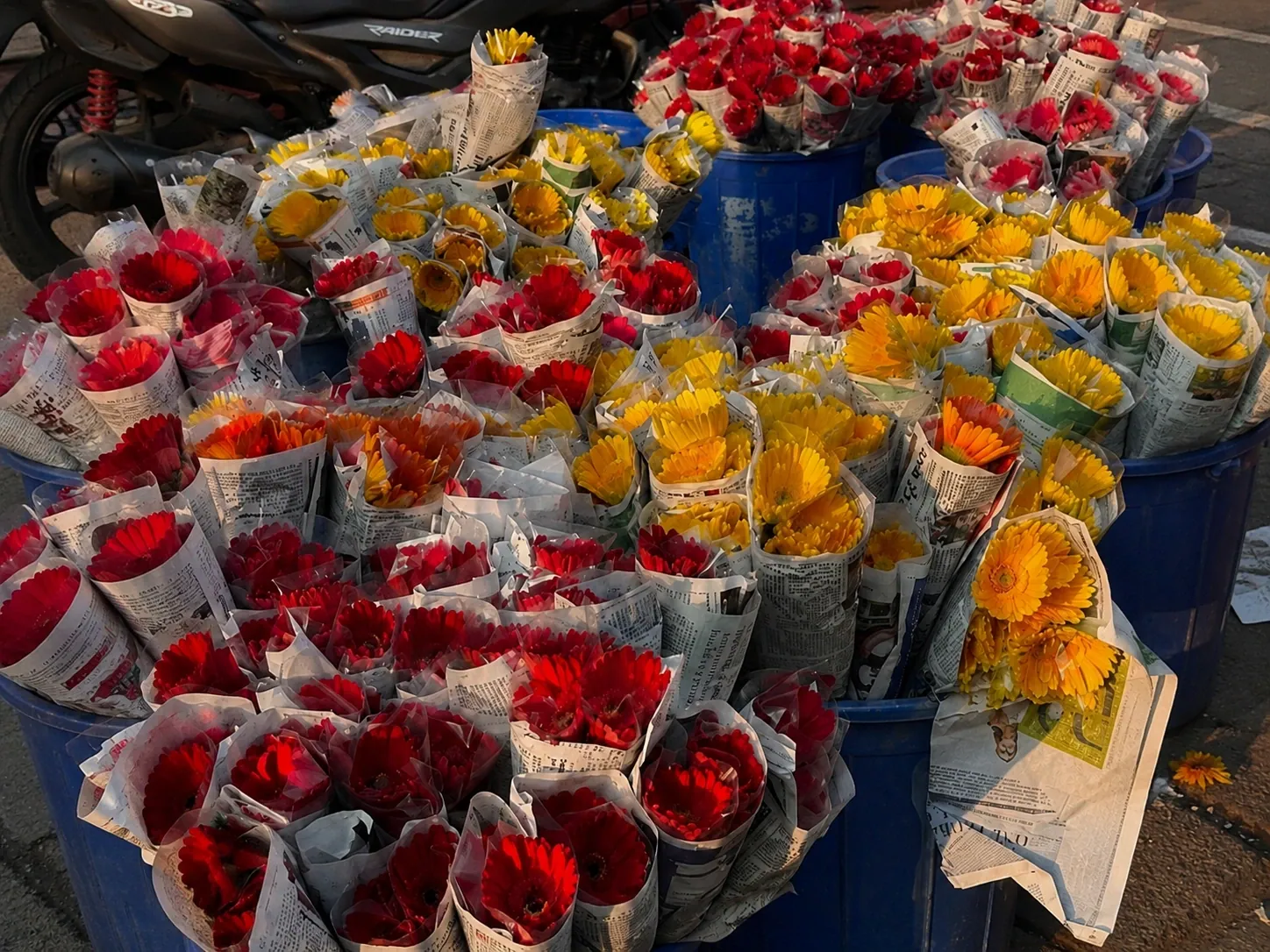 Fresh flowers at the wholesale market — gerberas and roses wrapped in newsprint